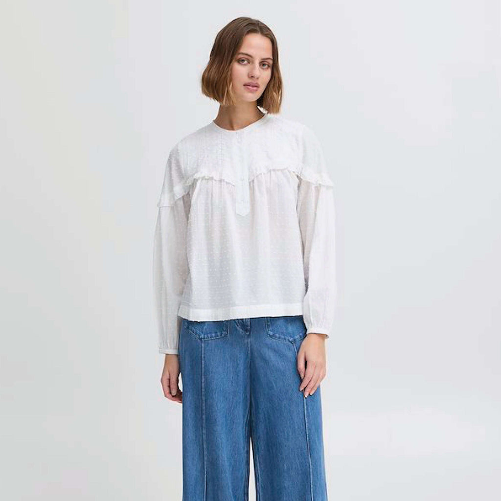 Atelier Reve Snow White Lauren Blouse with textured cotton, button-up neckline, and frill details.