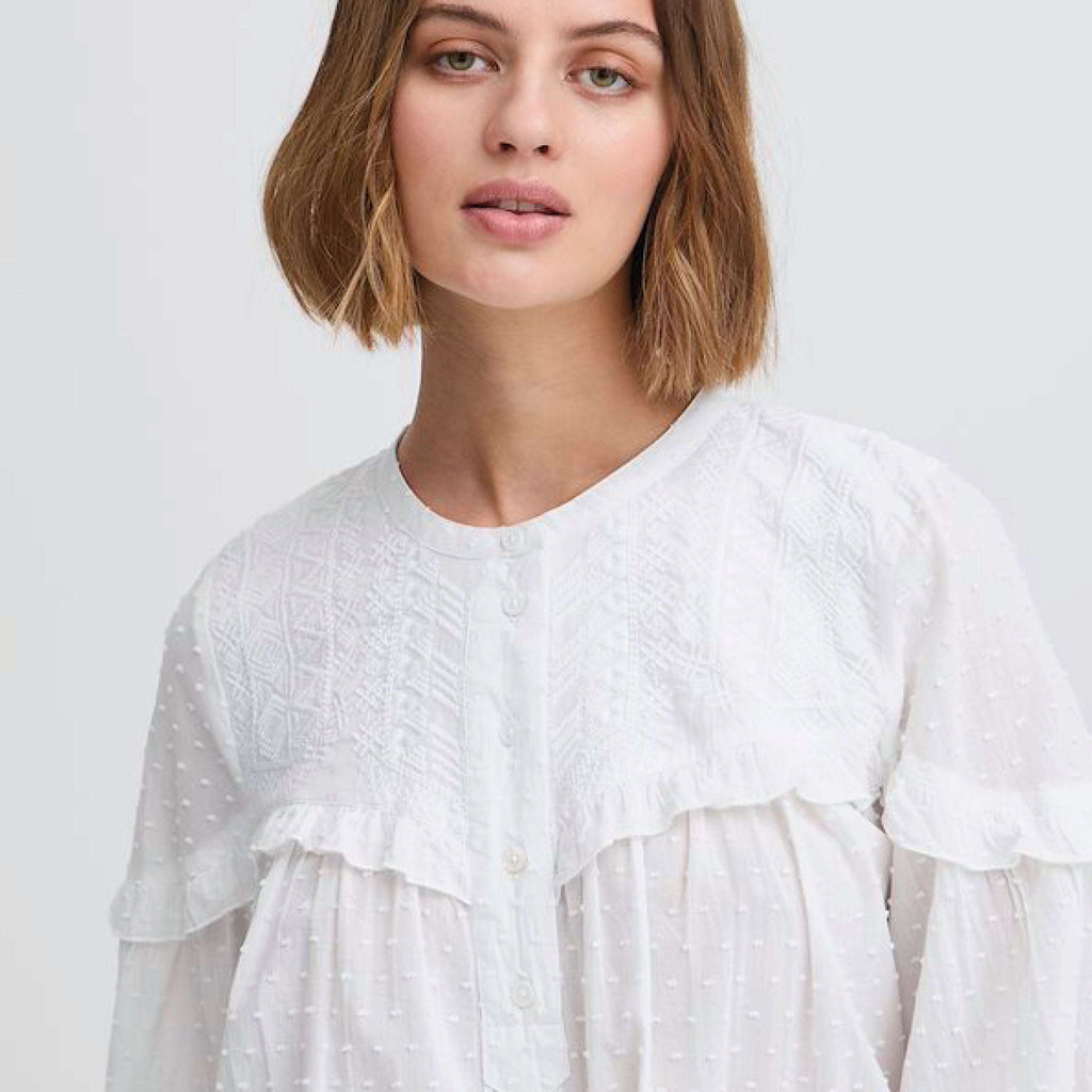 Atelier Reve Snow White Lauren Blouse with textured cotton, frill detail, and button-up neckline.