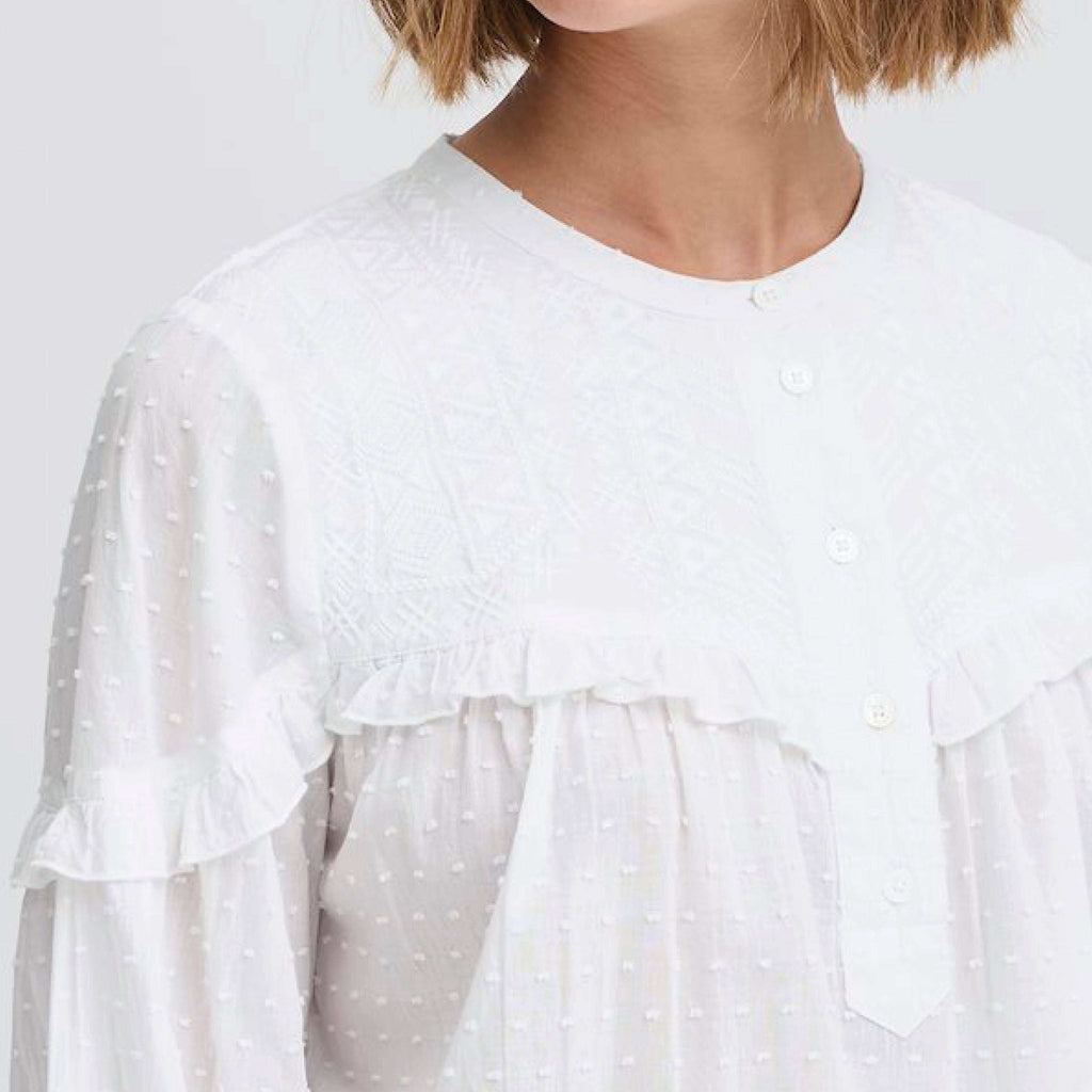 Atelier Reve Snow White Lauren Blouse with textured cotton, frill detail, and button-up neckline.