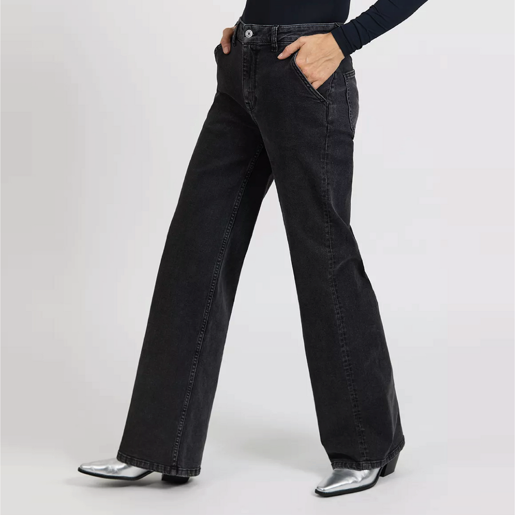 Reiko Black Pom Jeans with high waist and wide legs, featuring a zip fly and gold studded button.