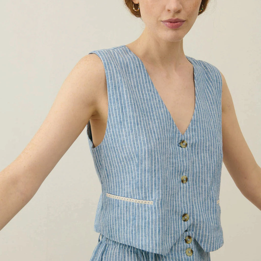 Sleeveless blue striped waistcoat with buttons on the front and lined with floral cotton veil.
Louise Misha Blue Onda Striped Franckie Waistcoat - Jo And Co Louise Misha Blue Onda Striped Franckie Waistcoat - Louise Misha