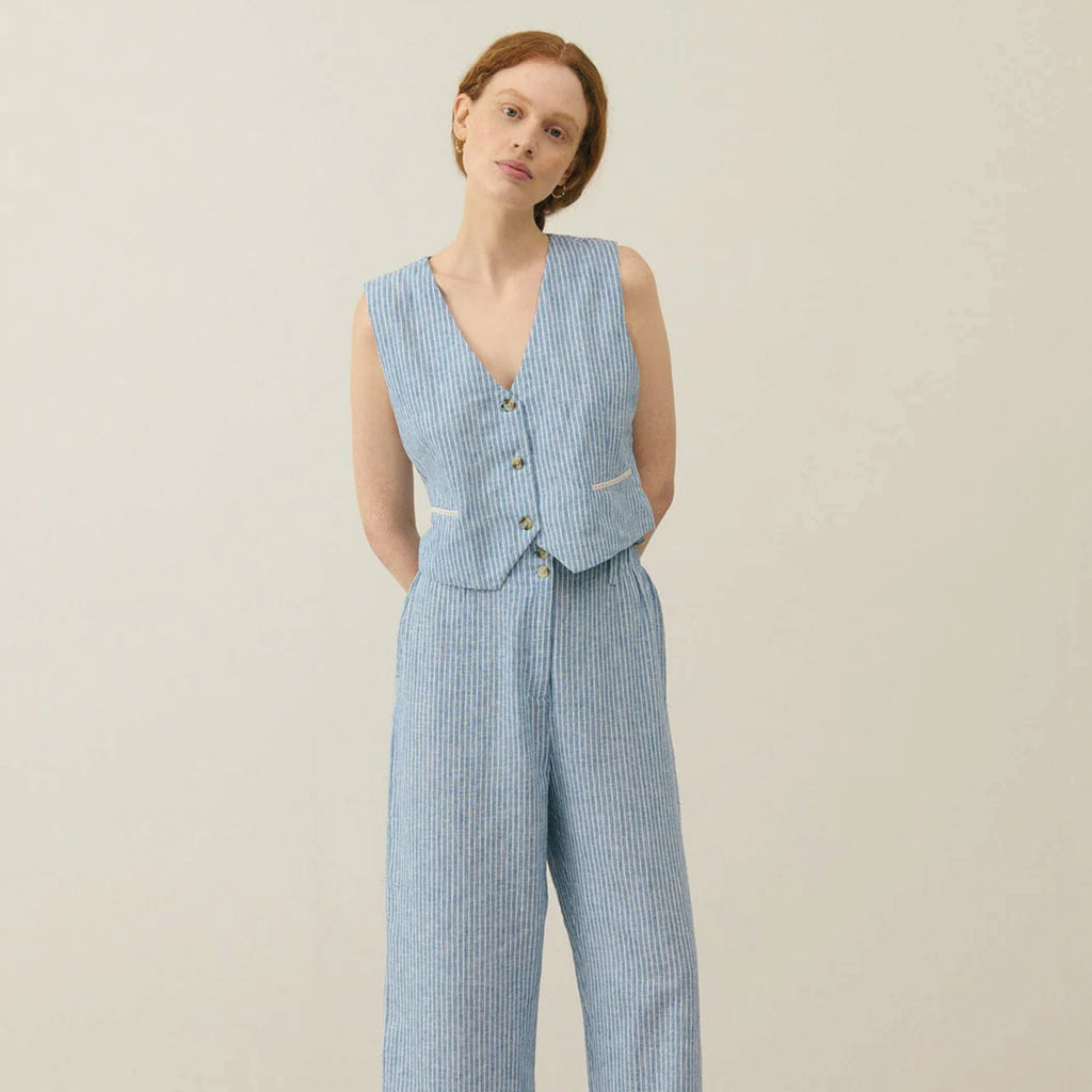 Sleeveless blue striped waistcoat with buttons on the front and lined with floral cotton veil.
Louise Misha Blue Onda Striped Franckie Waistcoat - Jo And Co Louise Misha Blue Onda Striped Franckie Waistcoat - Louise Misha