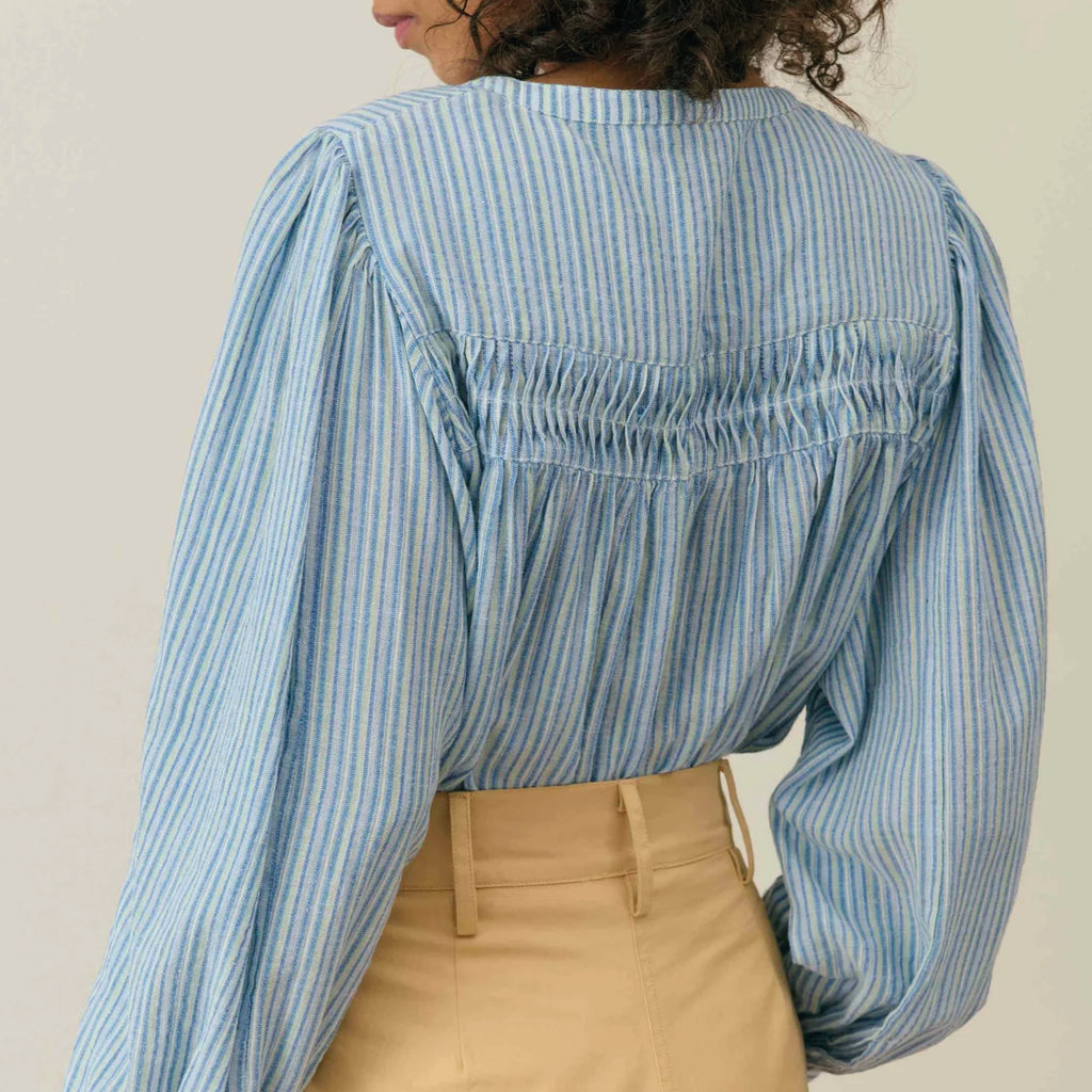 A blue and white blouse with pin stripe, buttoned centre, round neckline and lace inserts.
Louise Misha Blue Parasol Striped Jally Blouse - Jo And Co Louise Misha Blue Parasol Striped Jally Blouse - Louise Misha