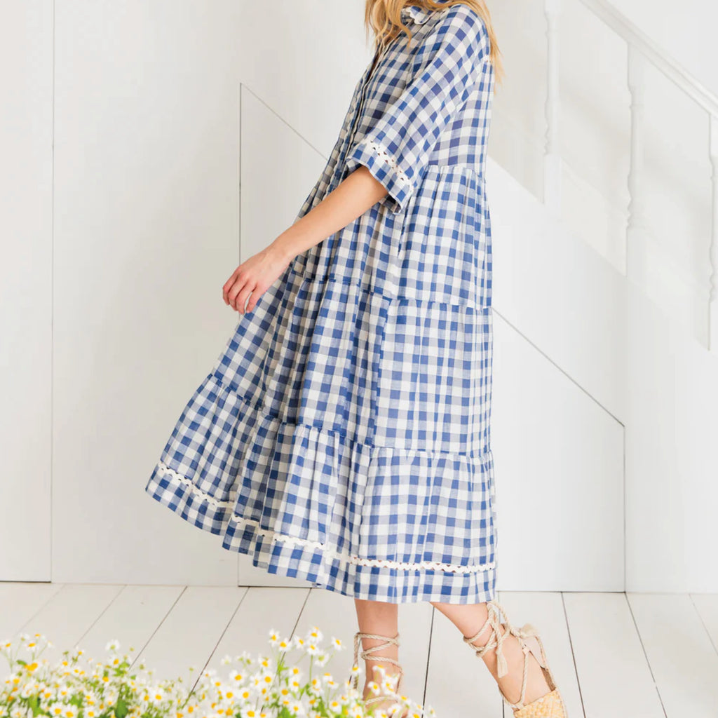 Loose fitting, tiered swing shape shirt dress in organic cotton blue & white gingham with ric-rac trim detail.
Bonté Blue & White Koko Dress - Jo And Co Bonté Blue & White Koko Dress - Bonté