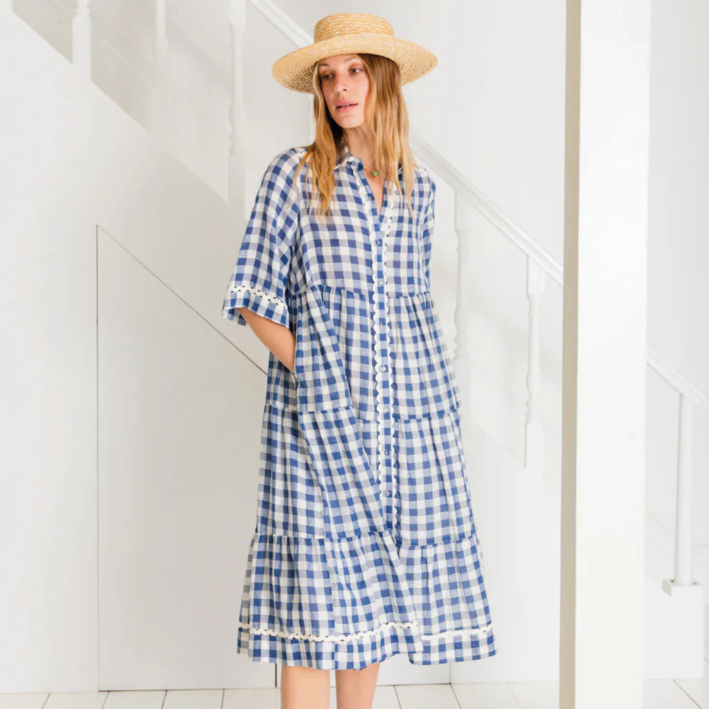 Loose fitting, tiered swing shape shirt dress in organic cotton blue & white gingham with ric-rac trim detail.
Bonté Blue & White Koko Dress - Jo And Co Bonté Blue & White Koko Dress - Bonté