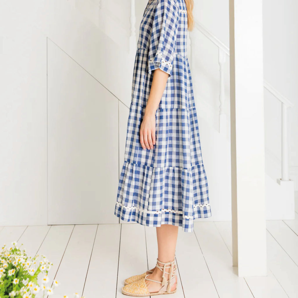 Loose fitting, tiered swing shape shirt dress in organic cotton blue & white gingham with ric-rac trim detail.
Bonté Blue & White Koko Dress - Jo And Co Bonté Blue & White Koko Dress - Bonté