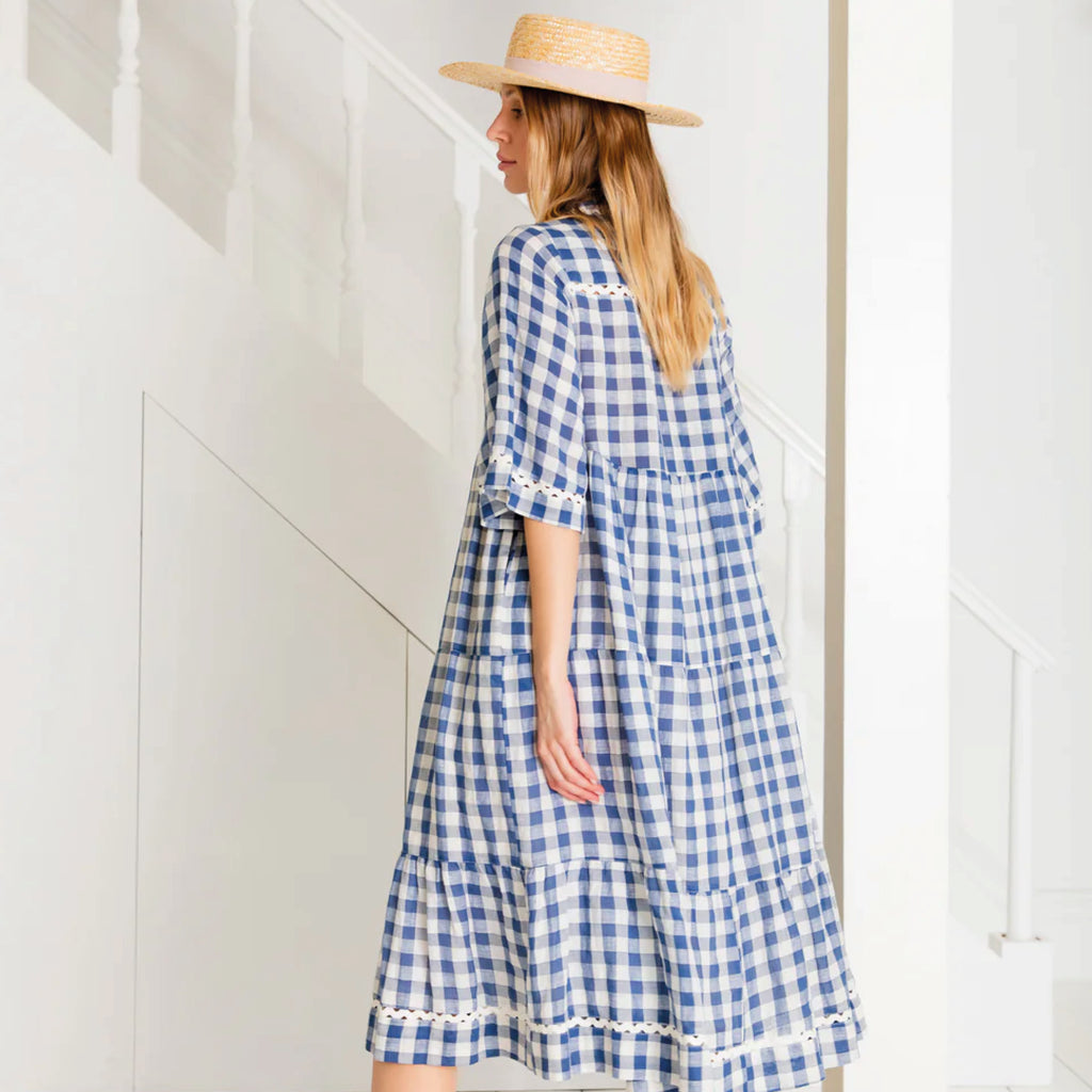 Loose fitting, tiered swing shape shirt dress in organic cotton blue & white gingham with ric-rac trim detail.
Bonté Blue & White Koko Dress - Jo And Co Bonté Blue & White Koko Dress - Bonté