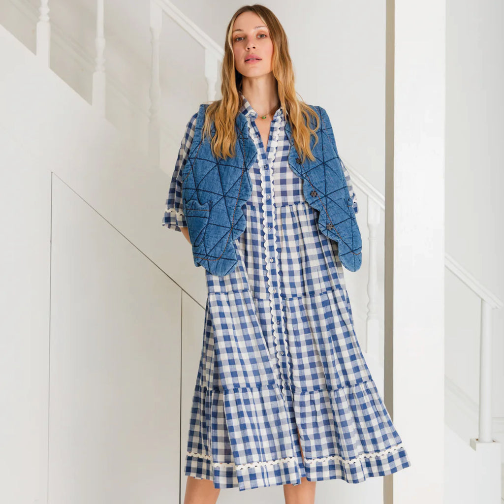 Loose fitting, tiered swing shape shirt dress in organic cotton blue & white gingham with ric-rac trim detail.
Bonté Blue & White Koko Dress - Jo And Co Bonté Blue & White Koko Dress - Bonté