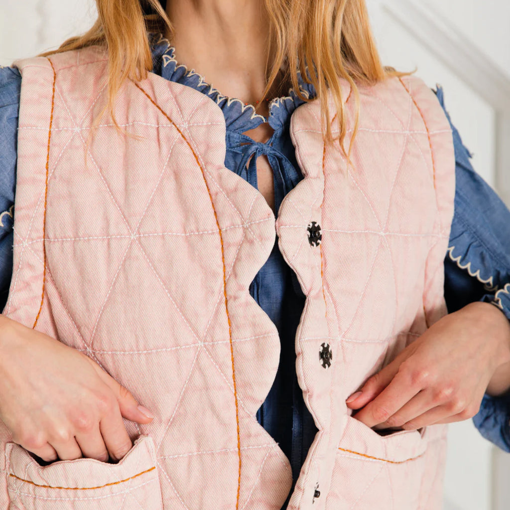 Chalk pink quilted gilet with scallop edge detail with a contrast hand running stitch detail.
Bonté Chalk Pink Estelle Gilet - Jo And Co Bonté Chalk Pink Estelle Gilet - Bonté