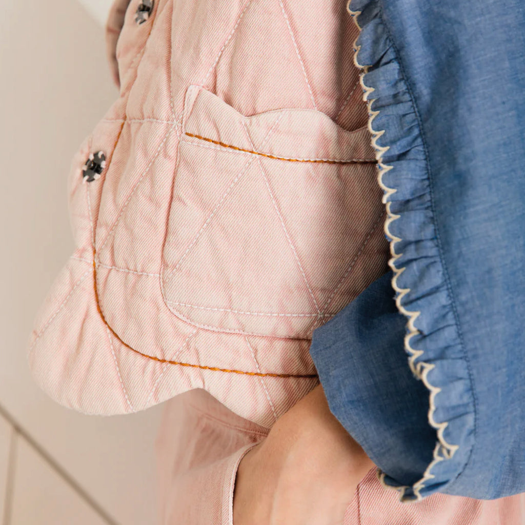 Chalk pink quilted gilet with scallop edge detail with a contrast hand running stitch detail.
Bonté Chalk Pink Estelle Gilet - Jo And Co Bonté Chalk Pink Estelle Gilet - Bonté