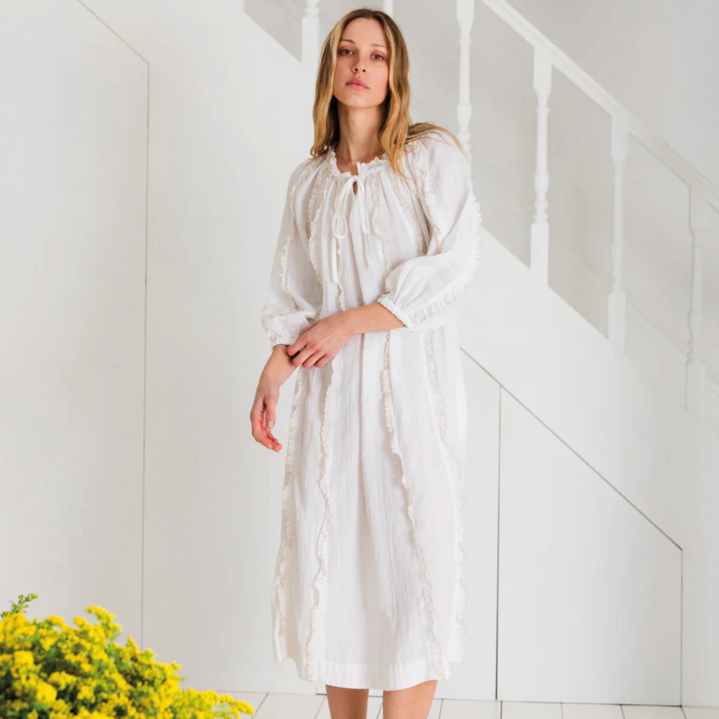 Loose fitting white dress in organic cotton double gauze, with contrast embroidered scalloped trims and tie neck.
Bonté White Fleur Dress - Jo And Co Bonté White Fleur Dress - Bonté