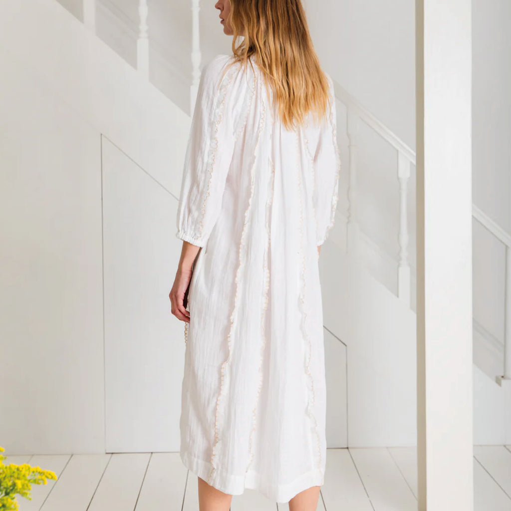 Loose fitting white dress in organic cotton double gauze, with contrast embroidered scalloped trims and tie neck.
Bonté White Fleur Dress - Jo And Co Bonté White Fleur Dress - Bonté