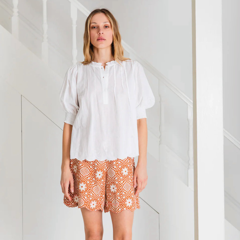 White cotton voile shirt with cross-stitch embroidery detail and frill collar, with tucks around the neck and a half placket opening with buttons.
Bonté White Loane Shirt - Jo And Co Bonté White Loane Shirt - Bonté