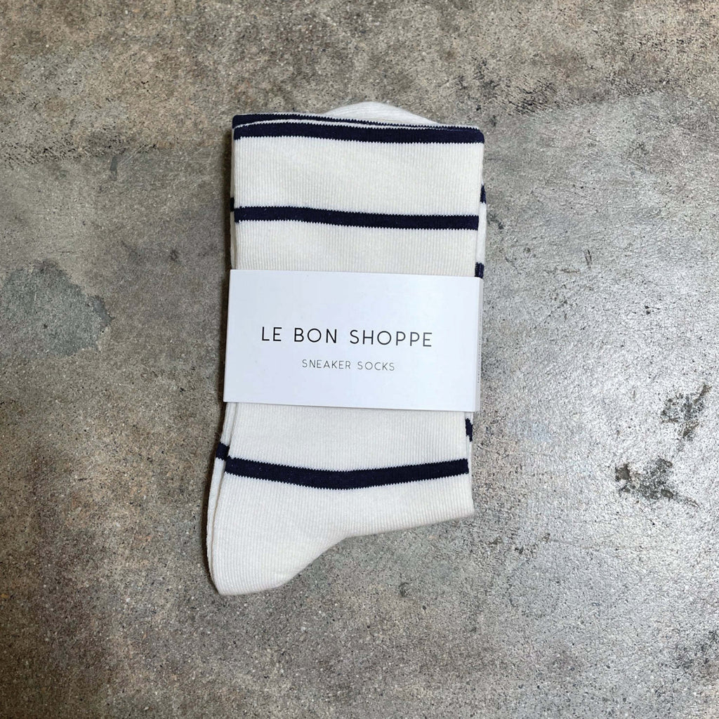 Le Bon Shoppe Breton Stripe Wally Socks with Parisian chic design on textured surface.