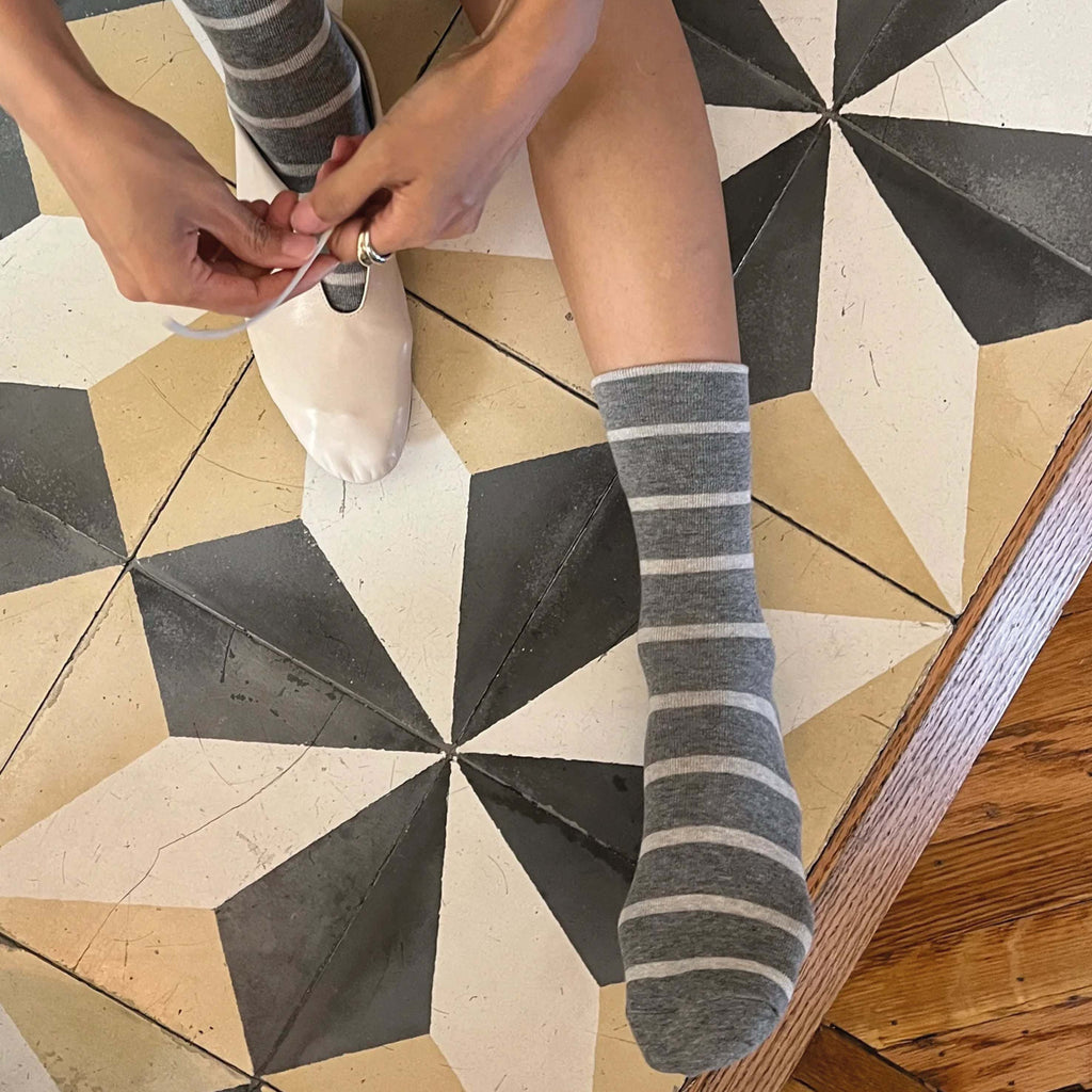 Le Bon Shoppe Cement Wally Socks with classic Parisian stripe pattern on tiled floor.