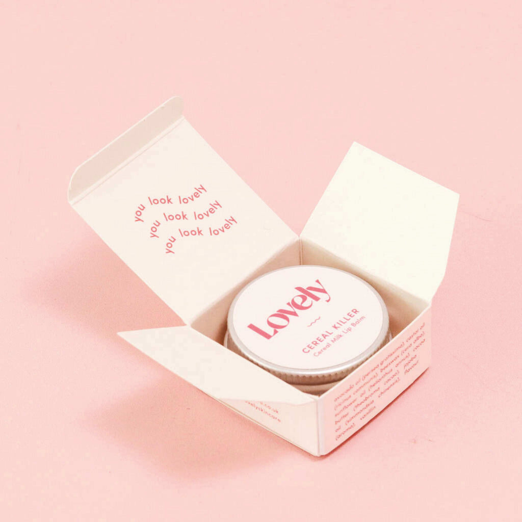 Cereal Milk Cereal Killer Lip Balm 15ml in an open box with 'Lovely' branding.