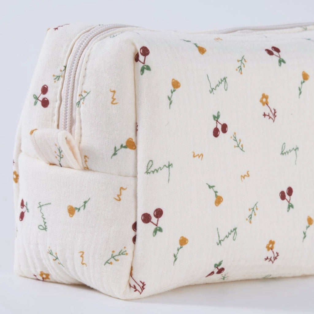 Crepe fabric wash bag with botanical pattern of hand-drawn cherries and flowers on cream cotton fabric with nylon zipper.
Cherry Wash Bag - Jo And Co Cherry Wash Bag