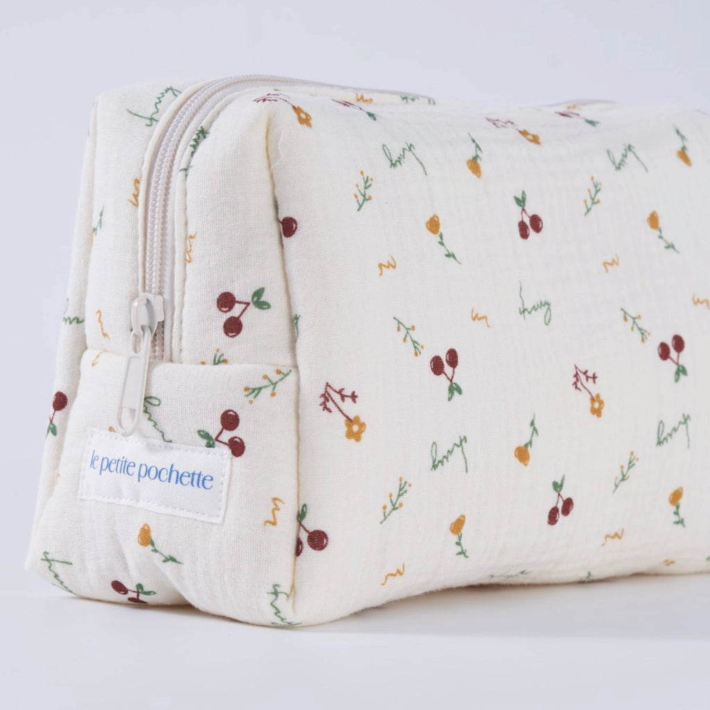 Crepe fabric wash bag with botanical pattern of hand-drawn cherries and flowers on cream cotton fabric with nylon zipper.
Cherry Wash Bag - Jo And Co Cherry Wash Bag