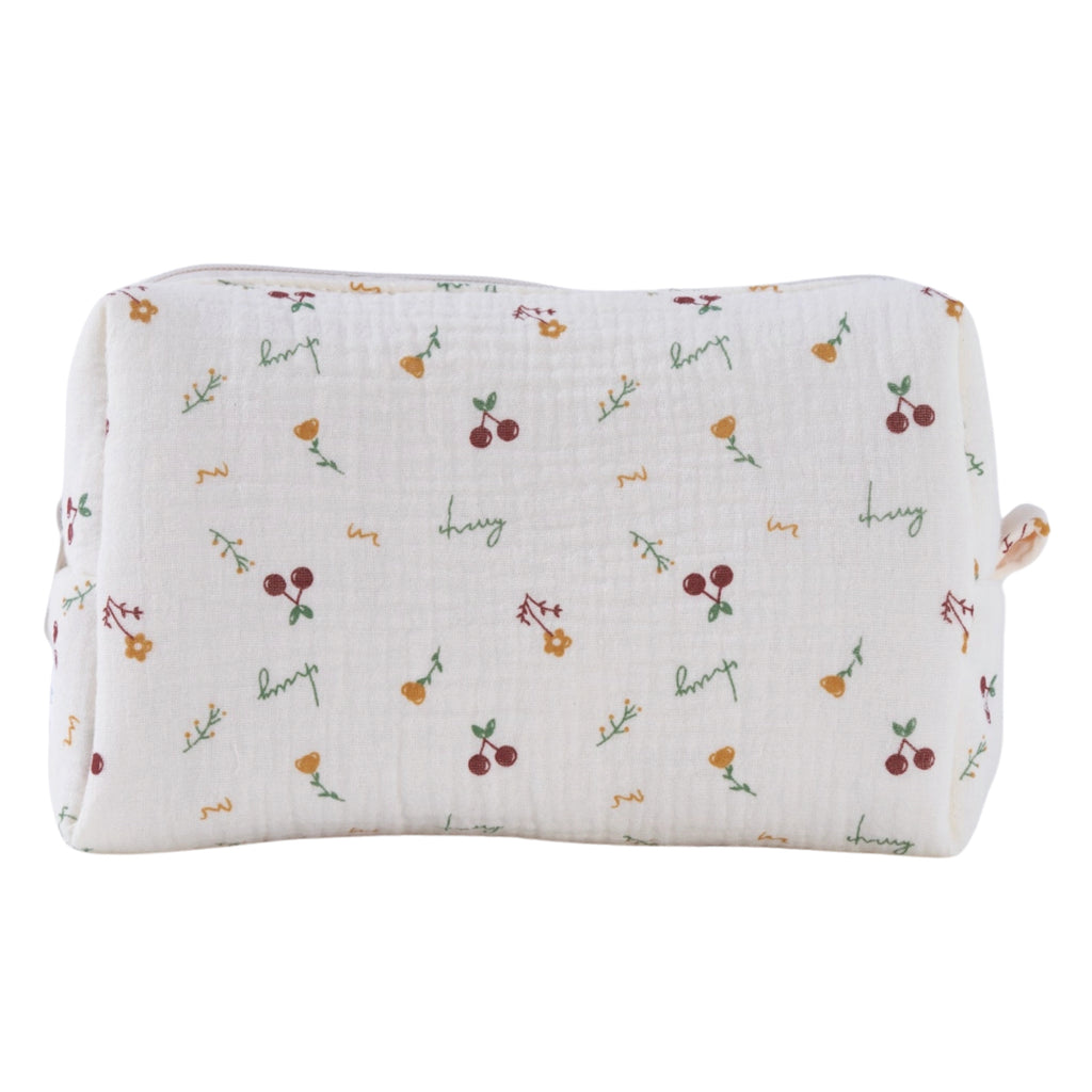 Crepe fabric wash bag with botanical pattern of hand-drawn cherries and flowers on cream cotton fabric with nylon zipper.
Cherry Wash Bag - Jo And Co Cherry Wash Bag