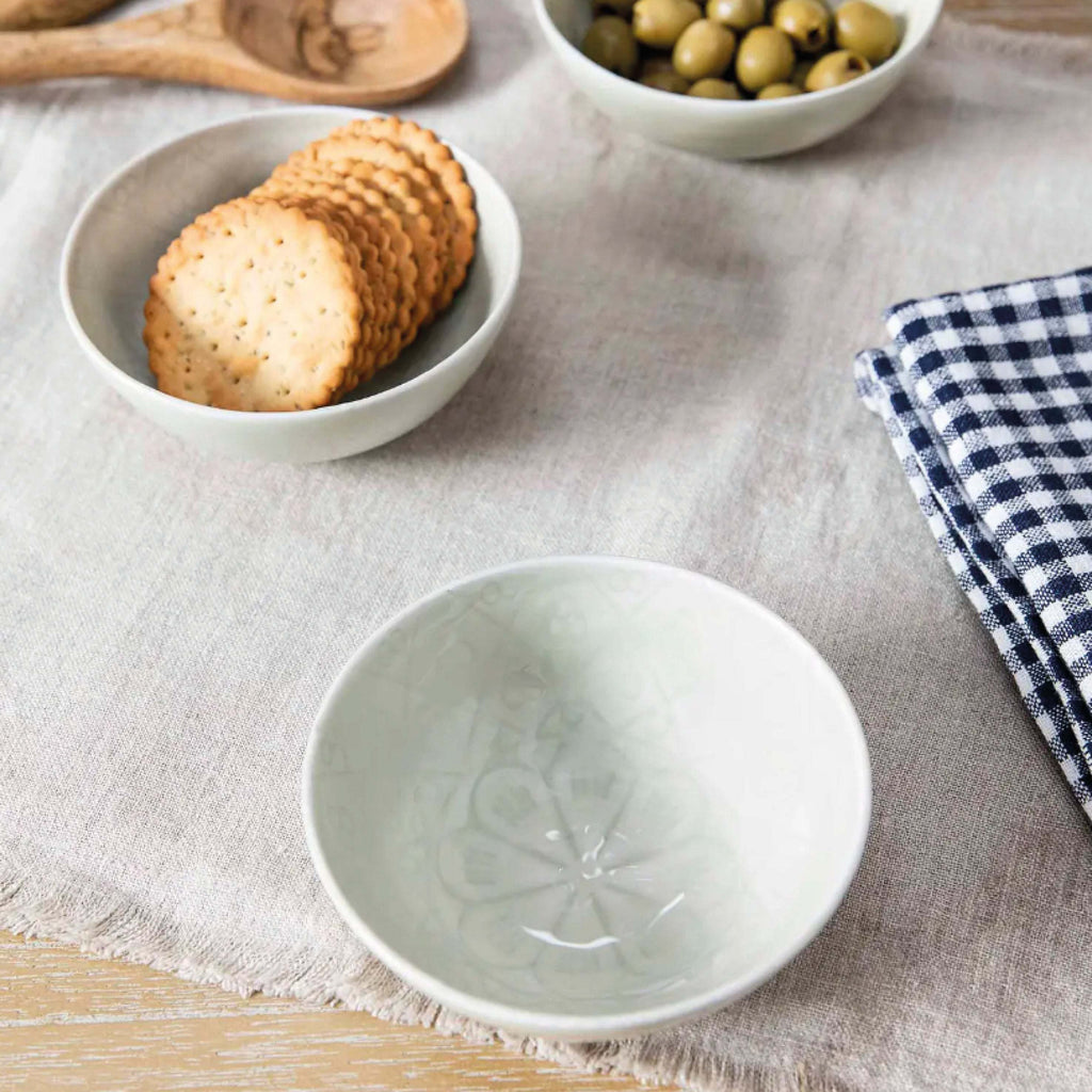 Clay Fiskardo Nibble Bowl on a table with crackers and olives, perfect for stylish serving.