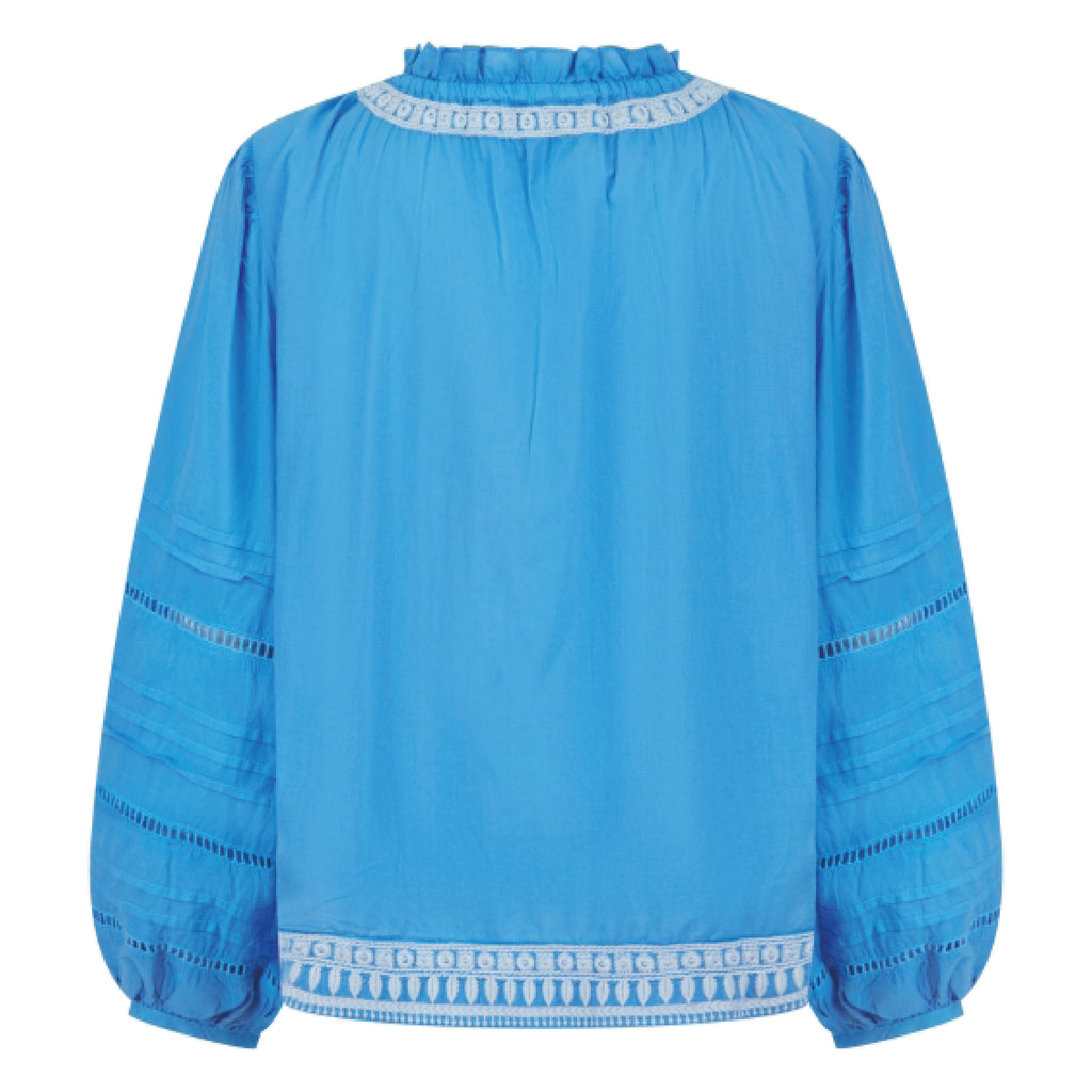 Cornflower blue blouse with embroidered neckline, hem and sleeve, balloon sleeve with ladder lace and pleating, and v-neckline.
Pranella Cornflower August Blouse - Jo And Co Pranella Cornflower August Blouse - Pranella