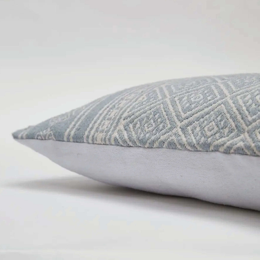 Cornflower Kalkan Cushion with textured jacquard design and white embroidery, made from recycled materials.