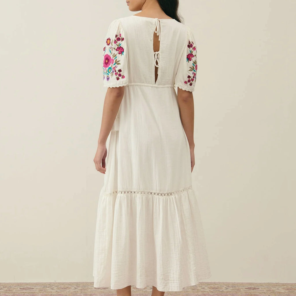 Long cream dress in organic cotton with plunging V-neck, tear drop back opening and embroidered butterfly sleeves with lace edges.
Louise Misha Cream Balina Dress - Jo And Co Louise Misha Cream Balina Dress - Louise Misha