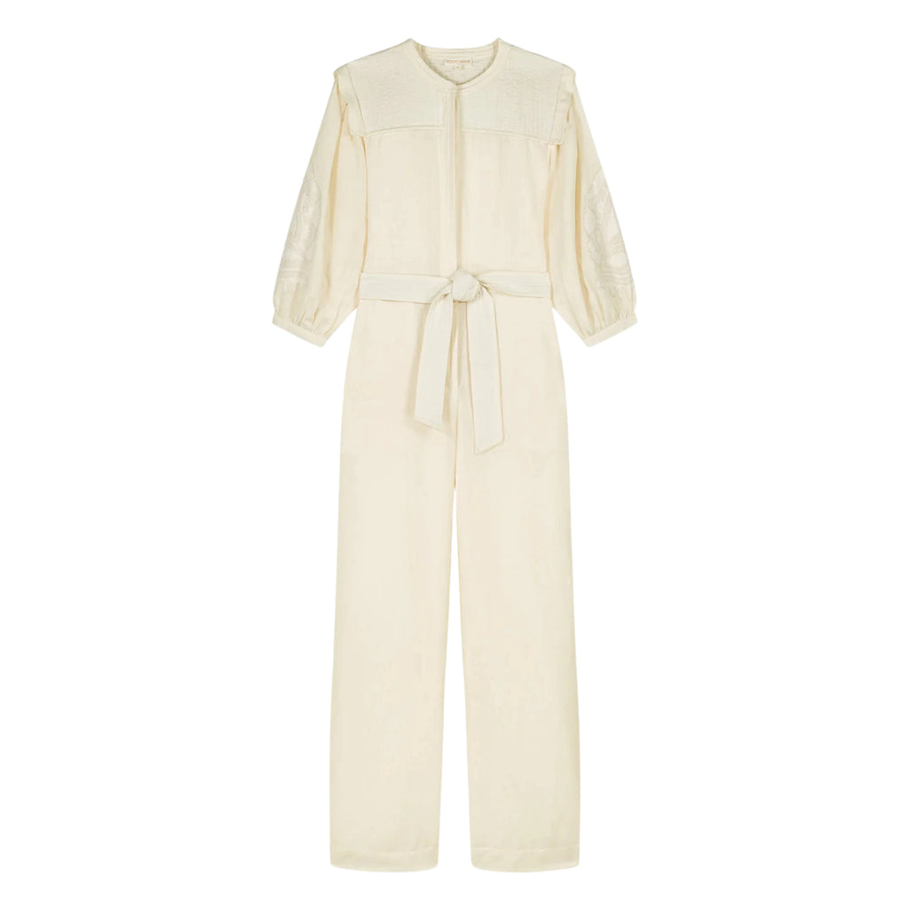 Cream cotton and linen blend jumpsuit with round neckline, lightly quilted breastplate with embroidery details. 
Louise Misha Cream Sylvianna Jumpsuit - Jo And Co Louise Misha Cream Sylvianna Jumpsuit - Louise Misha