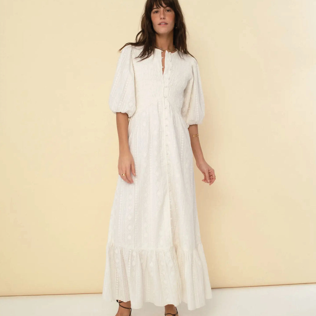 Long ecru dress with delicate embroidery organic cotton. Round neck, smocked bodice, crochet trimming and full-length skirt.
Sonmer Ecru Magnolia Dress - Jo And Co Sonmer Ecru Magnolia Dress - Sonmer