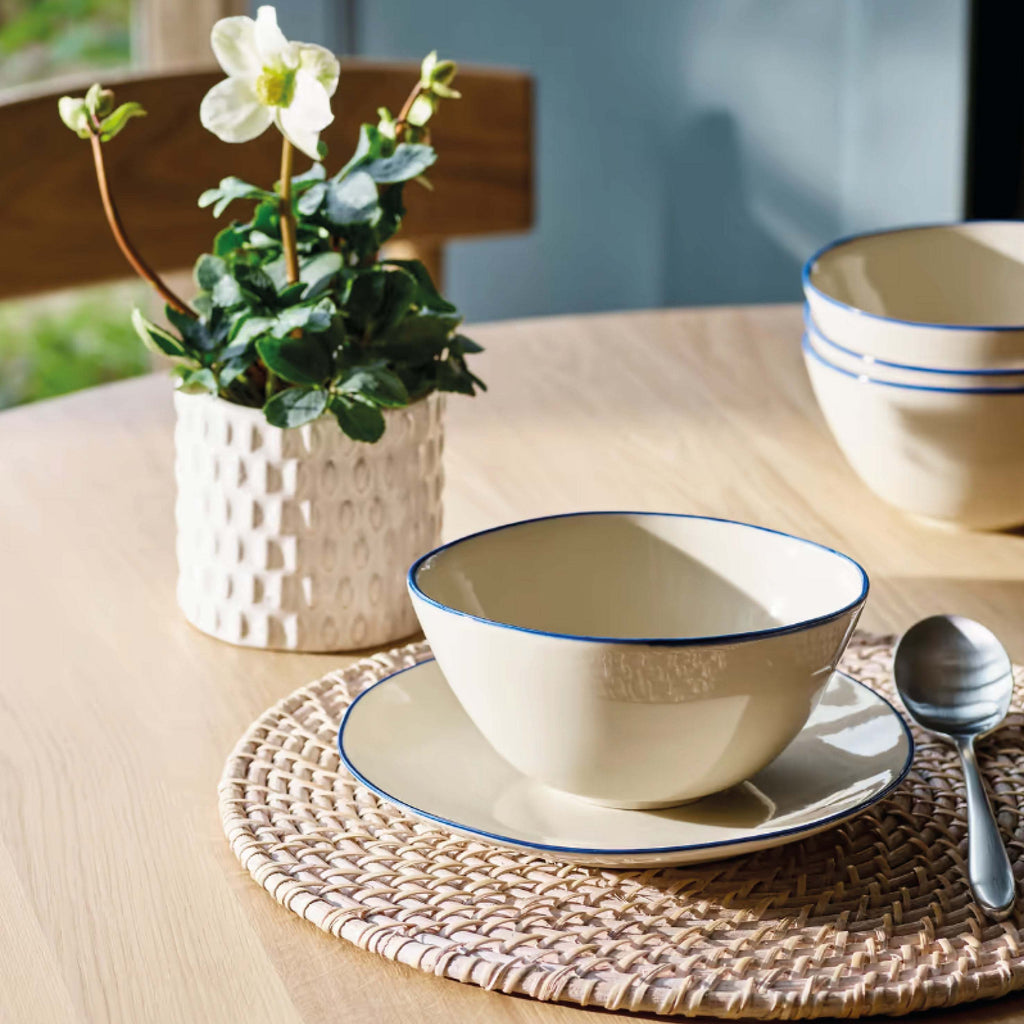 Ink Shipston Cereal Bowl with hand-painted inky blue rim on a table setting.