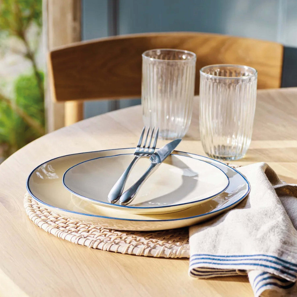 Ink Shipston Pasta Bowl with rustic hand-painted blue rim on a table setting.