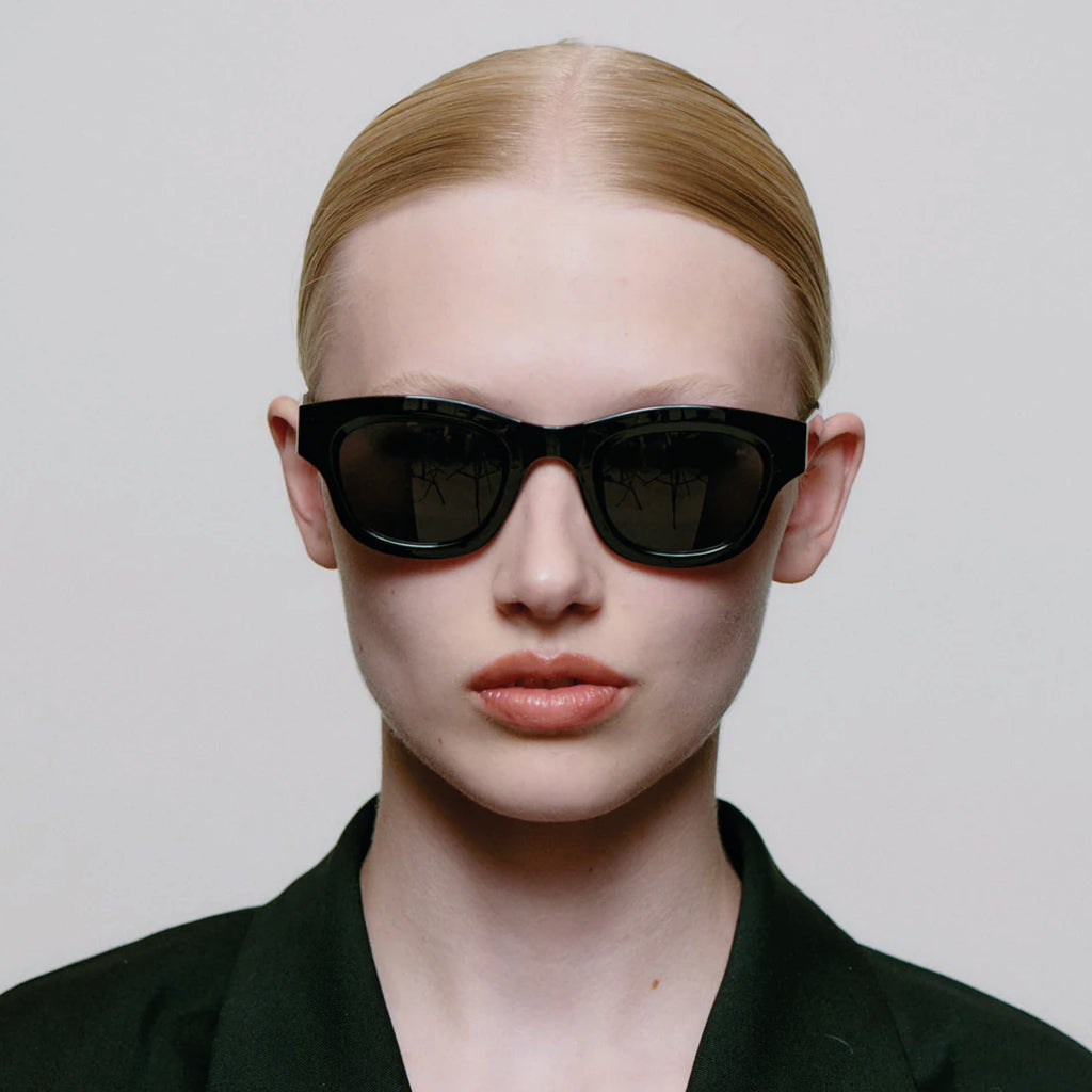 Black sunglasses with linear bottom and a rounded top.
A.KJAERBEDE Lane Black Sunglasses - Jo And Co A.KJAERBEDE Lane Black Sunglasses - A.KJAERBEDE