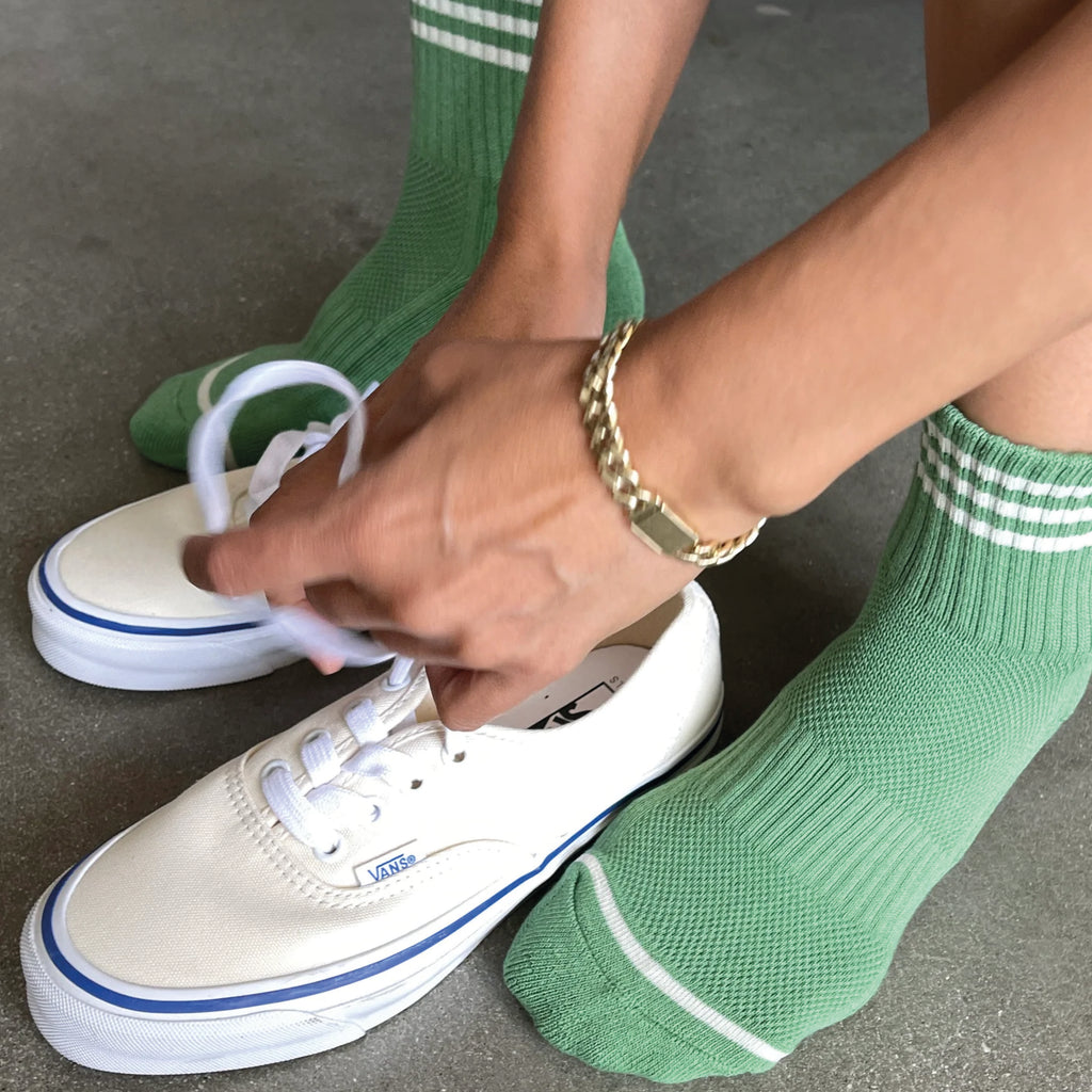 Avocado green socks with triple contrast stripe, short crew sock length and Le Bon Shoppe text on sole.
Le Bon Shoppe Avocado Girlfriend Socks - Jo And Co Le Bon Shoppe Avocado Girlfriend Socks - Le Bon Shoppe