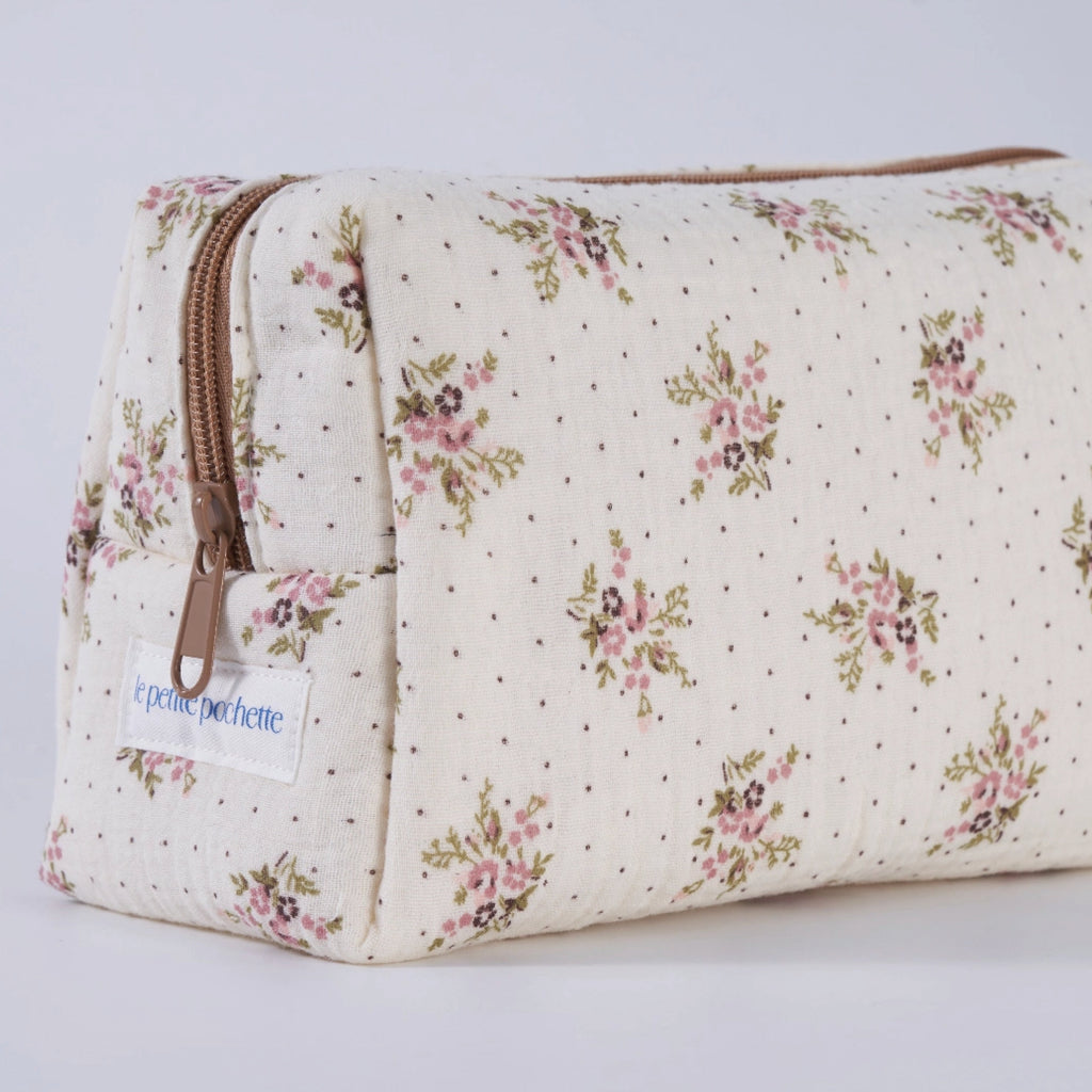 Crepe fabric wash bag with pink roses and sage green leaves pattern with tiny brown dots, and coordinating light brown zipper.
Lilac Floral Wash Bag - Jo And Co Lilac Floral Wash Bag