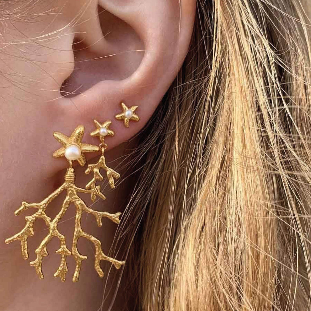 Hultquist Copenhagen Mini Sea Star Stud Earrings with 18K gold-plated sterling silver and freshwater pearls.