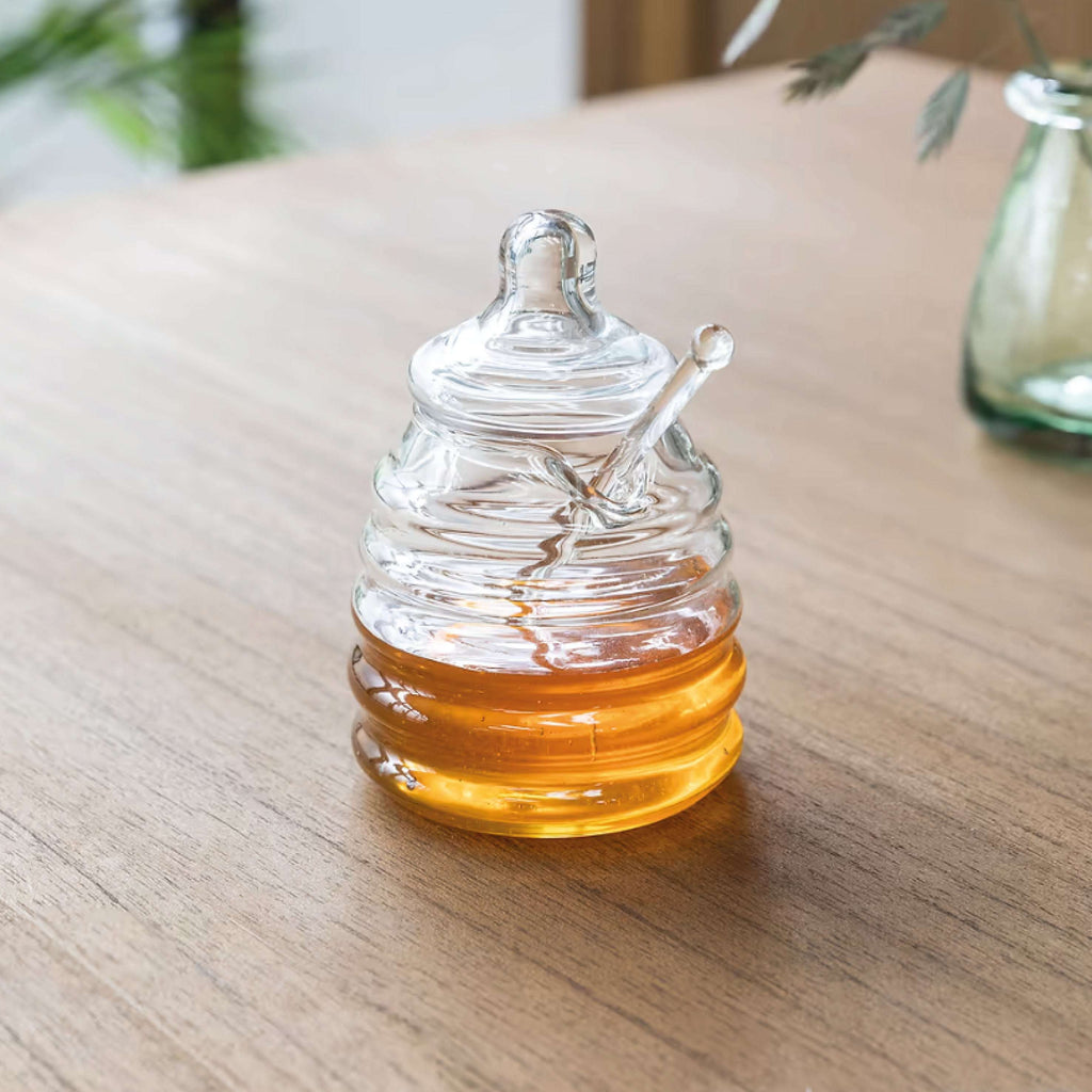 Murcot Glass Honey Pot with hand-blown recycled glass and matching dibber on wooden table.