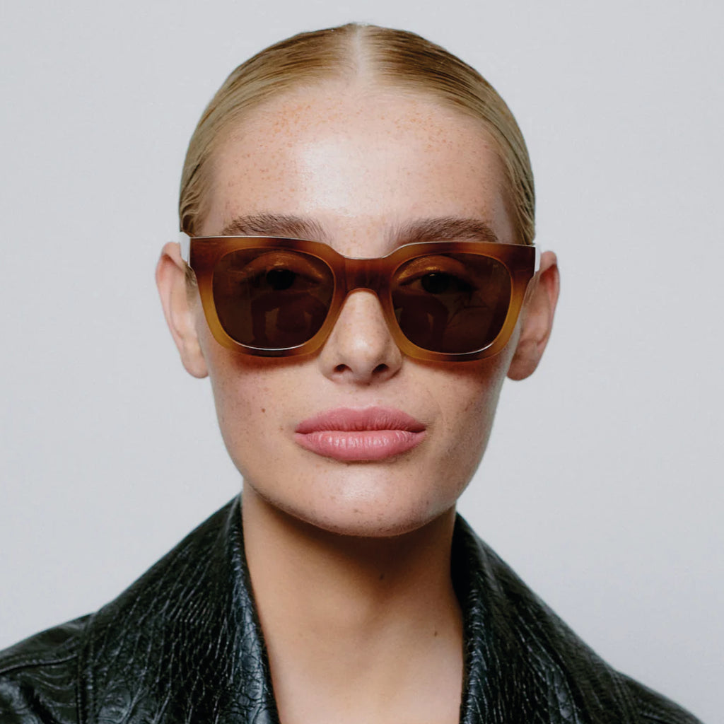 Brown square shape and medium-sized frame sunglasses.
A.KJAERBEDE Nancy Demi Brown Sunglasses - Jo And Co A.KJAERBEDE Nancy Demi Brown Sunglasses - A.KJAERBEDE