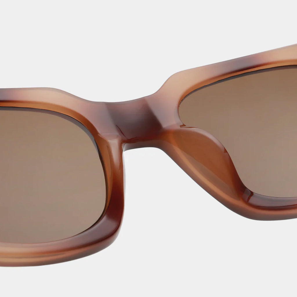 Brown square shape and medium-sized frame sunglasses.
A.KJAERBEDE Nancy Demi Brown Sunglasses - Jo And Co A.KJAERBEDE Nancy Demi Brown Sunglasses - A.KJAERBEDE