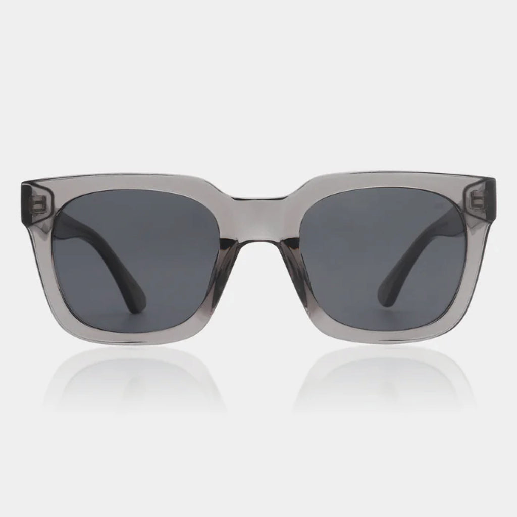 Grey transparent sunglasses with square shape and medium-sized frame.
A.KJAERBEDE Nancy Grey Transparent Sunglasses - Jo And Co A.KJAERBEDE Nancy Grey Transparent Sunglasses - A.KJAERBEDE