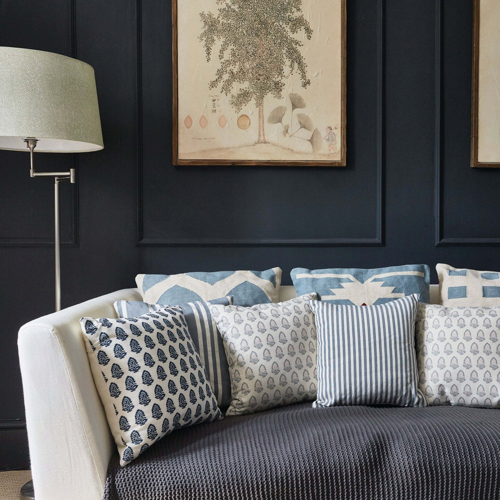 Navy Acorn Canvas Cushion with durable print, 45x45 cm, on a stylish sofa setting.