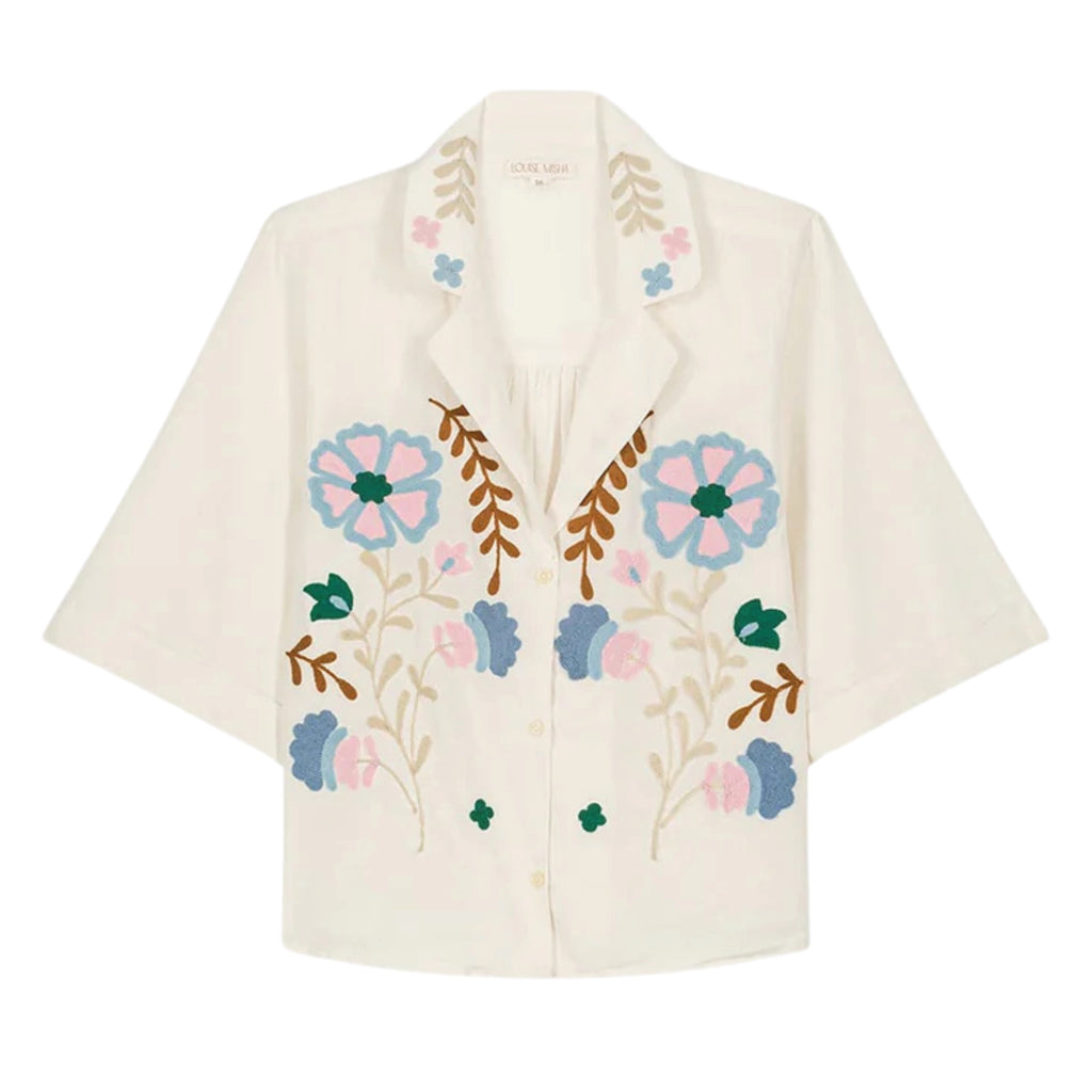 Short-sleeved crop shirt with large textured embroideries on the front and collar with a notched collar.
Louise Misha Off White Emile Shirt - Jo And Co Louise Misha Off White Emile Shirt - Louise Misha