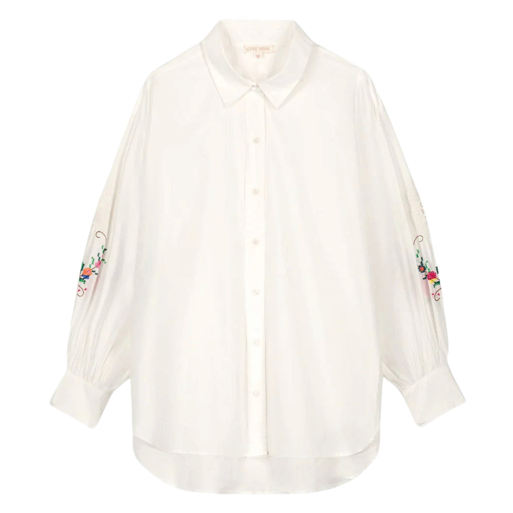 White cotton poplin shirt with puff sleeves with crochet-style lace details and vintage-inspired cross-stitch embroidery.
Louise Misha Off White Reynald Shirt - Jo And Co Louise Misha Off White Reynald Shirt - Louise Misha