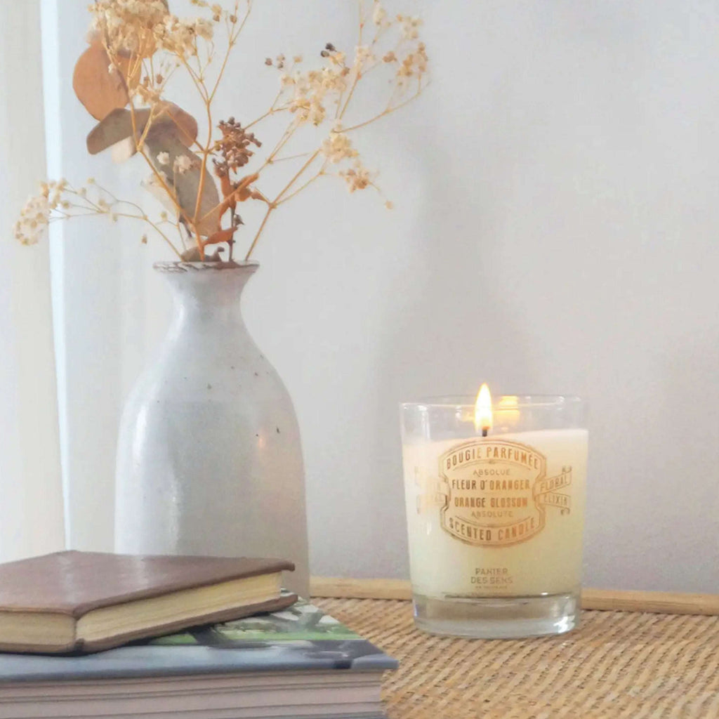 Panier Des Sens Orange Blossom Scented Candle 180g in a cozy home setting.