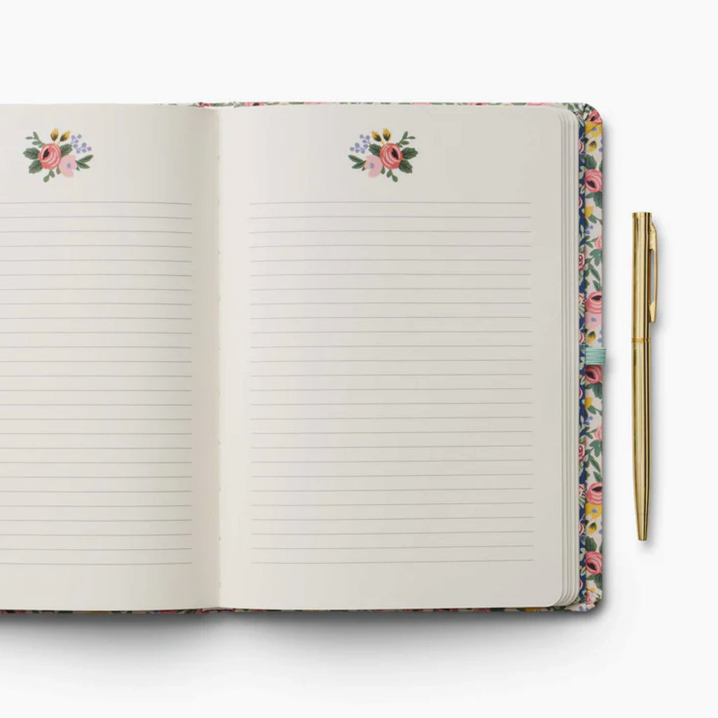 The Rosa Journal features a floral cover, elastic band and 144 pages with a gold pen with black ink.
Rifle Paper Co Rosa Journal With Pen - Jo And Co Rifle Paper Co Rosa Journal With Pen - Rifle Paper Co