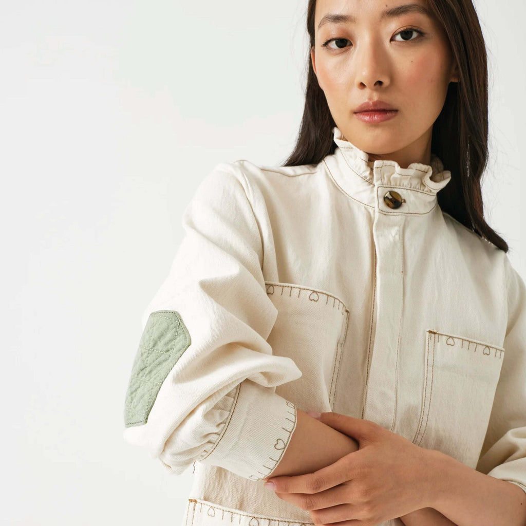 Seventy + Mochi Ecru Dear Pablo Jacket with floral embroidery and frill collar.