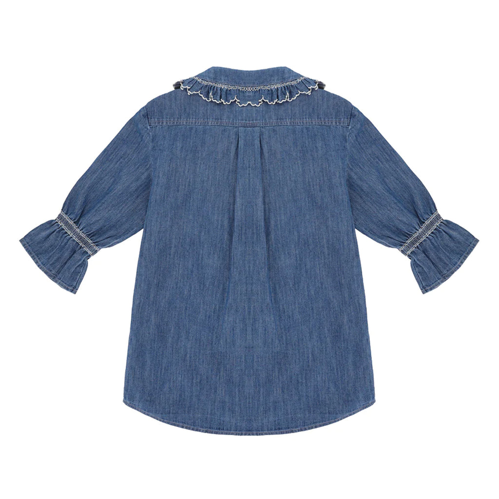 Indigo denim blue blouse with embroidered frill collar and cuffs and feminine cropped sleeves.
Seventy + Mochi Indigo Denim Daisy Blouse - Jo And Co Seventy + Mochi Indigo Denim Daisy Blouse - Seventy + Mochi