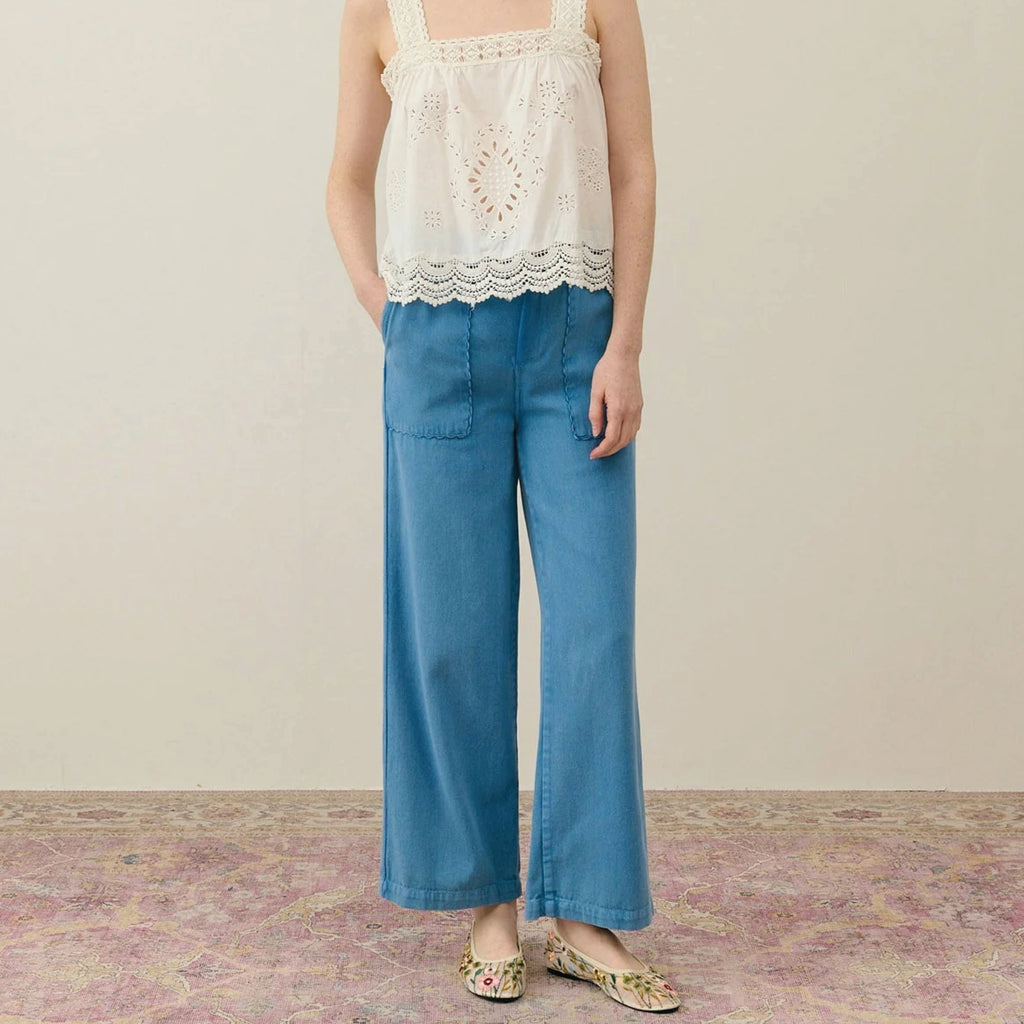 Straight cut blue cotton trousers with front patch pockets with slant opening and rickrack edges.
Louise Misha Stone Blue Florette Trousers - Jo And Co Louise Misha Stone Blue Florette Trousers - Louise Misha