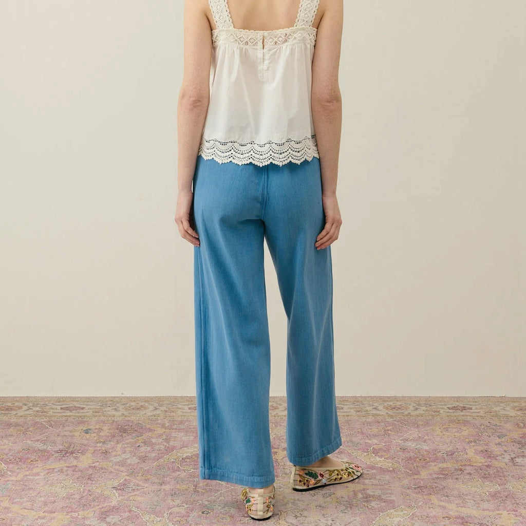 Straight cut blue cotton trousers with front patch pockets with slant opening and rickrack edges.
Louise Misha Stone Blue Florette Trousers - Jo And Co Louise Misha Stone Blue Florette Trousers - Louise Misha