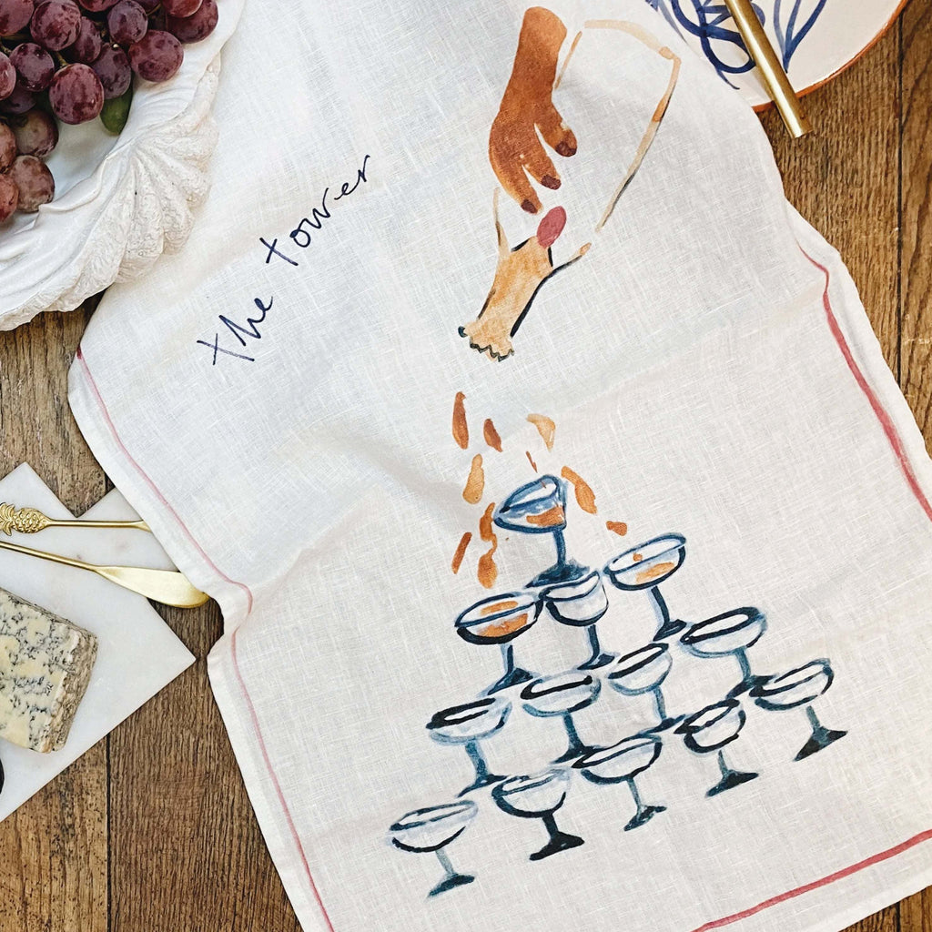 Hand-painted watercolor champagne tower linen teatowel; soft, antibacterial, ideal for gifting or art.